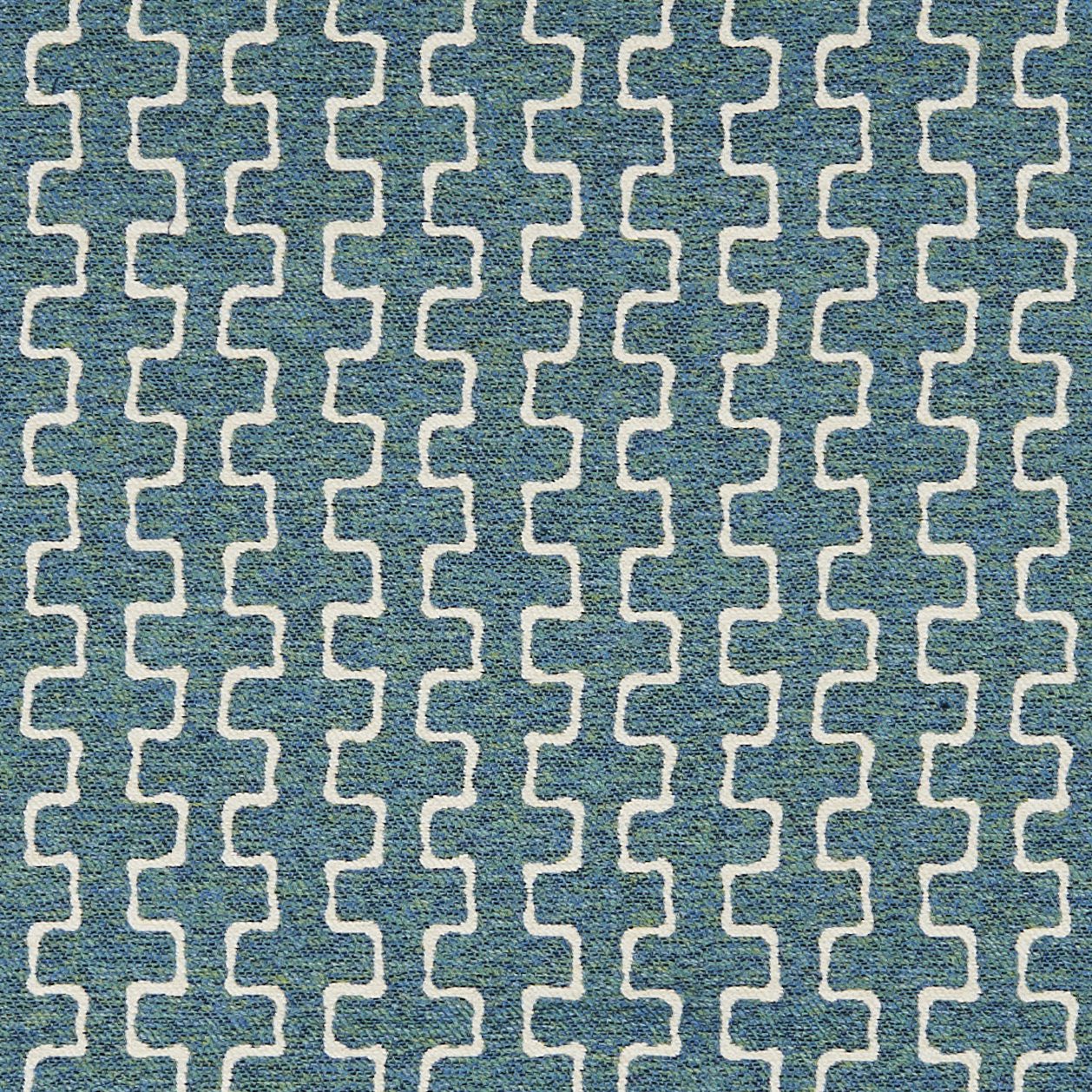 Blue woven fabric with white interlocking geometric lattice pattern; outdoor jacquard twill texture.