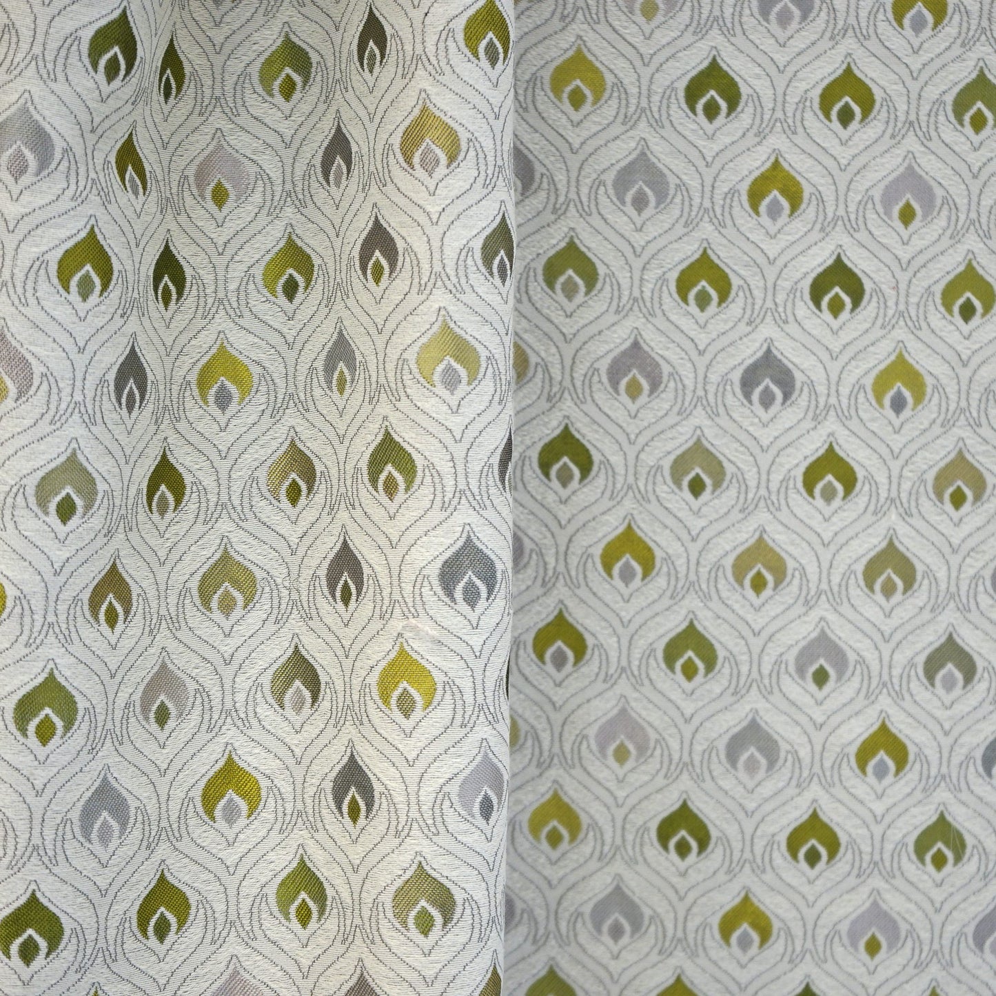 Cream background fabric with repeating flame-teardrop motifs in green and olive, with gray and mustard accents; versatile upholstery or drapery textile.