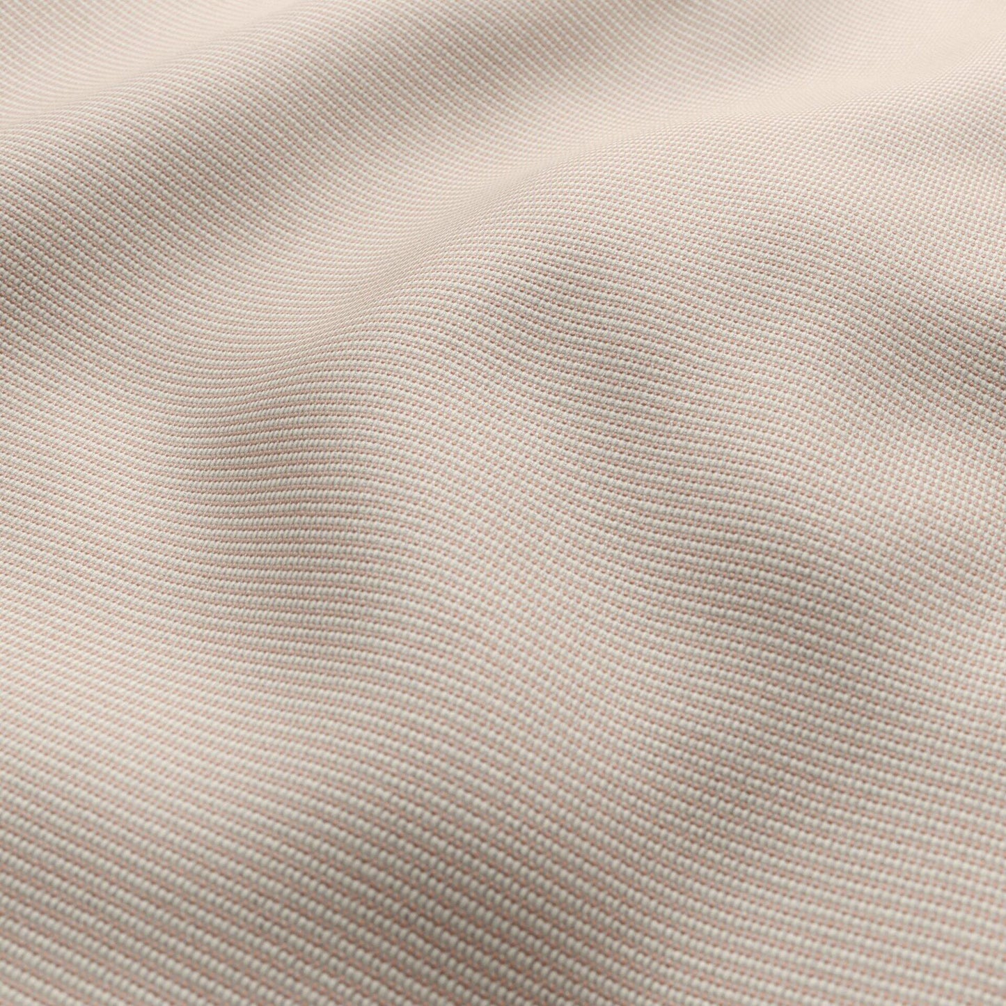 Close-up of pink outdoor basketweave fabric with a fine woven texture and soft folds.