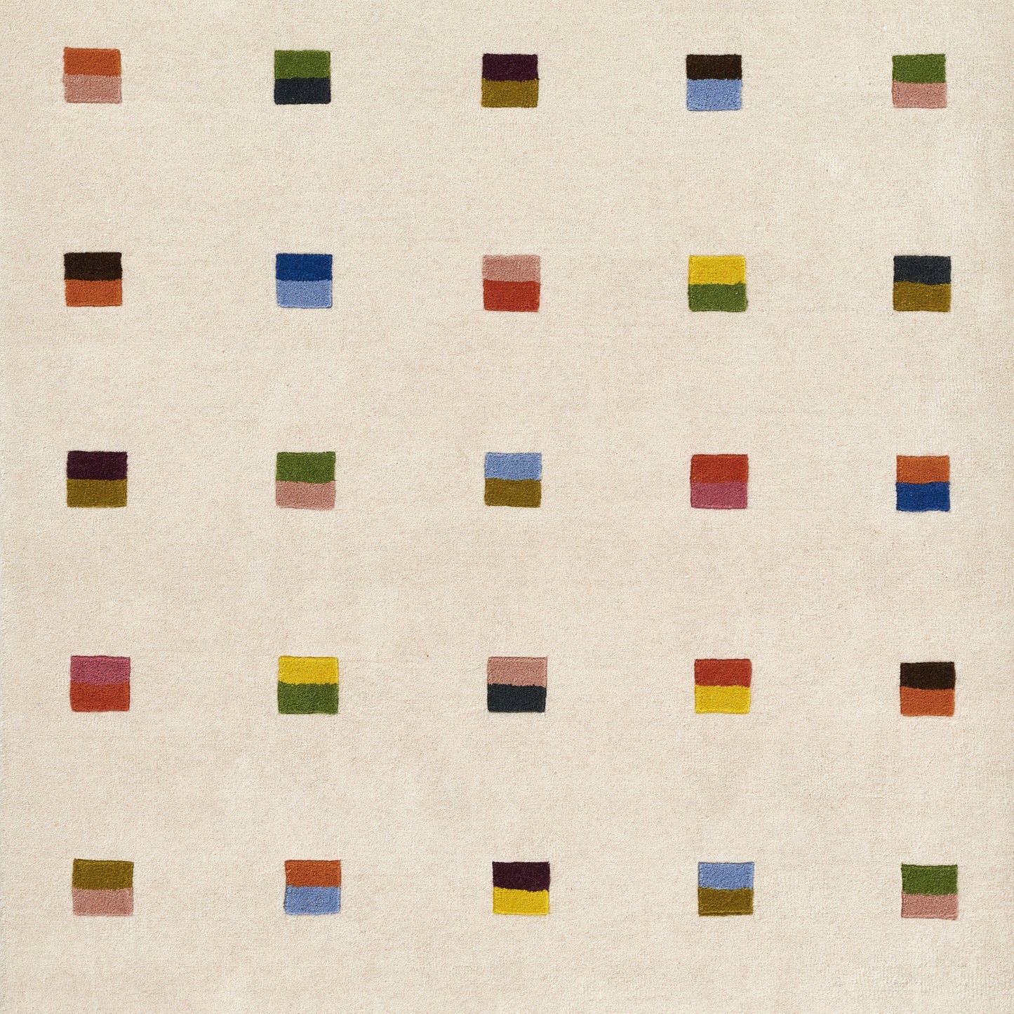 Beige woven fabric with a spaced grid of small two-tone color blocks in various hues; modern abstract pattern.