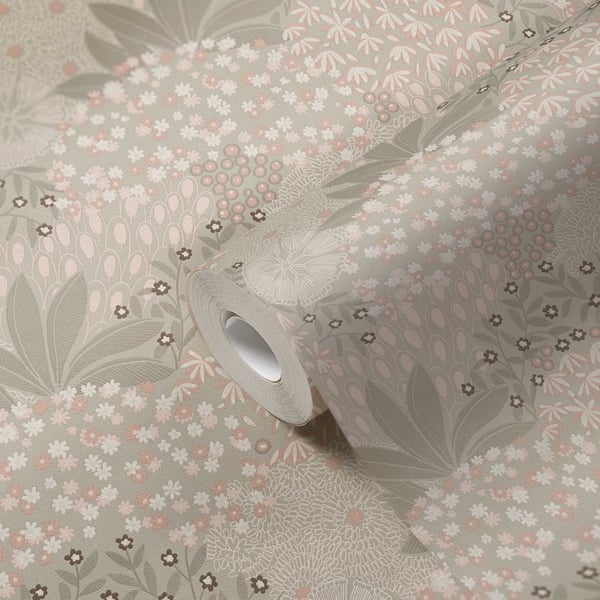 Roll of beige wallpaper with a floral motif featuring blossoms and leaves.