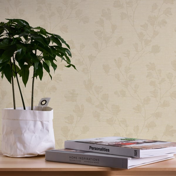 Beige wallcovering with a subtle floral trail pattern.