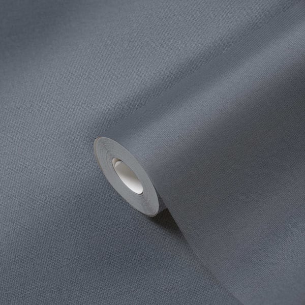 Blue Hessian‑effect textured wallcovering roll, shown rolled on a white core; close-up of the coarse woven texture.