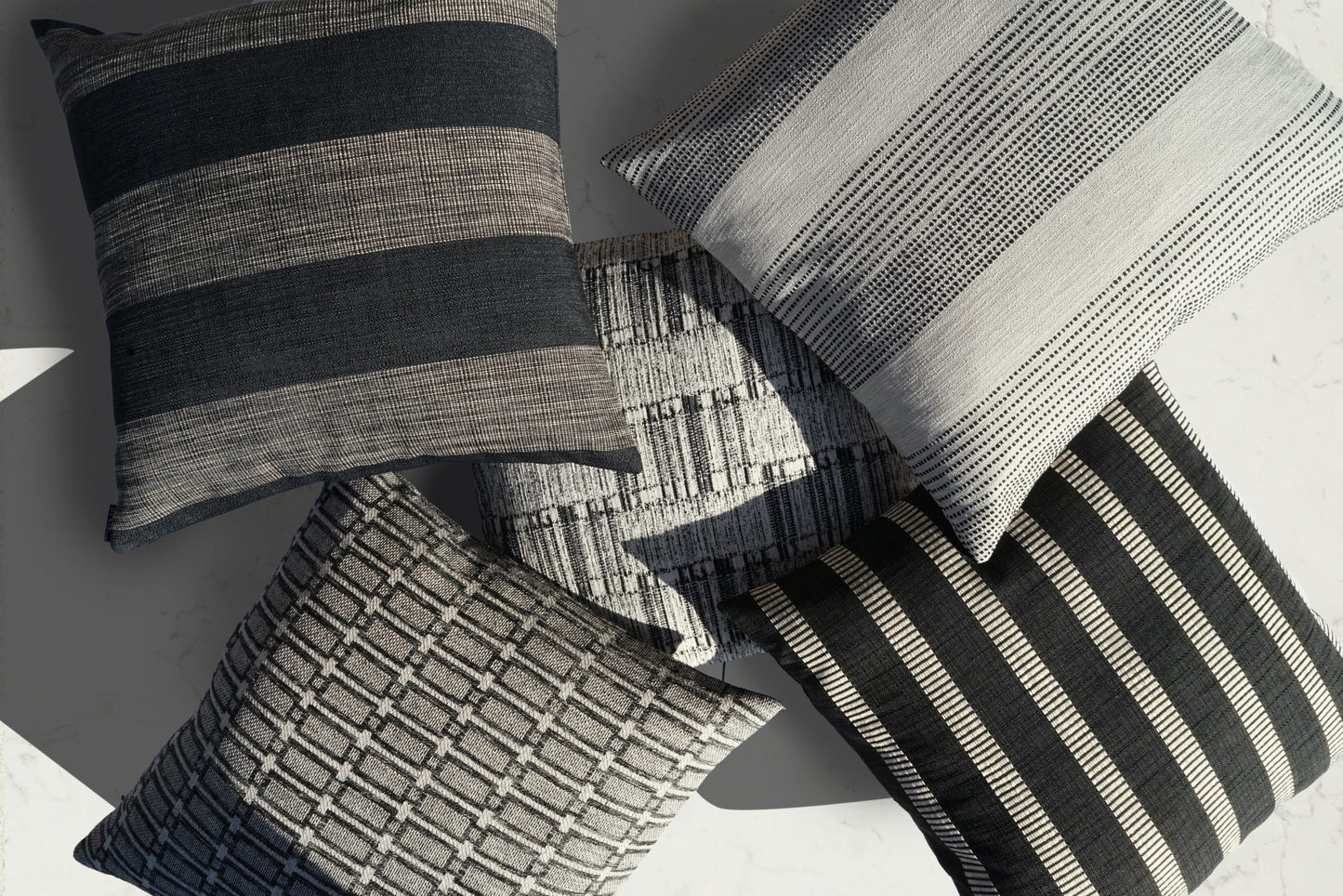 Square 24" x 24" pillow with black, gray, and white striped textured woven pattern.