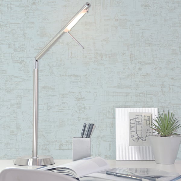 Blue blueprint-pattern wallpaper on wall.