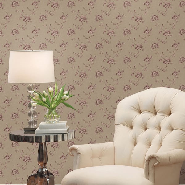Beige wallpaper with a rose floral pattern on the wall.