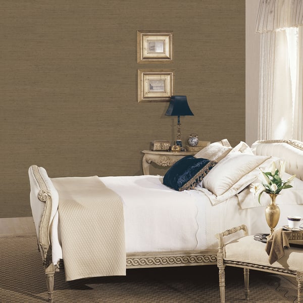 Close-up of gold silk-texture wallpaper with subtle sheen.