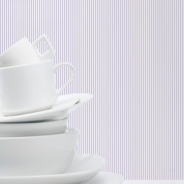 Delicate pinstripe wallpaper in purple and lilac tones.
