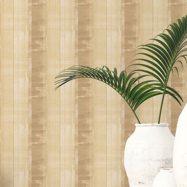 Beige striped wallpaper with a white ceramic vase and green palm fronds for tropical home decor.