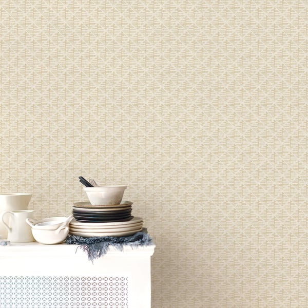 Beige block print wallpaper with a subtle pattern.