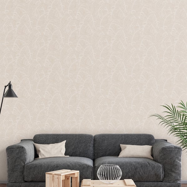Beige patterned wallpaper on the wall of a living room; visible dark gray sectional sofa with beige cushions, black floor lamp, and light wood coffee table.