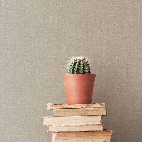 Beige textured wallpaper with a subtle woven pattern