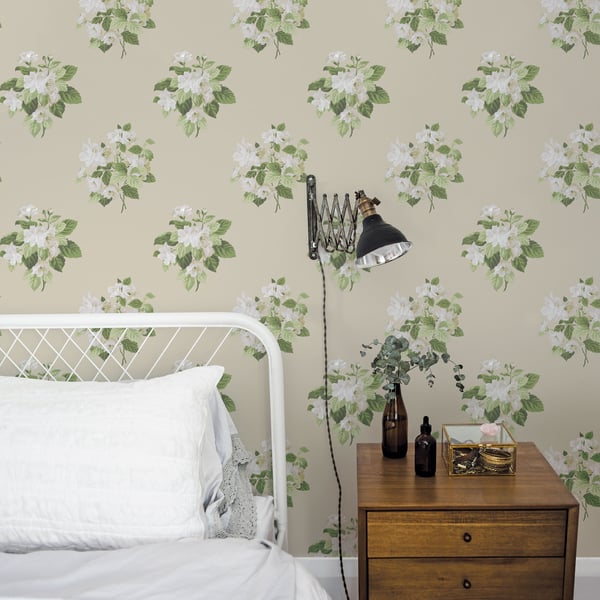 Beige floral wallpaper with a botanical bouquet pattern and subtle green accents.