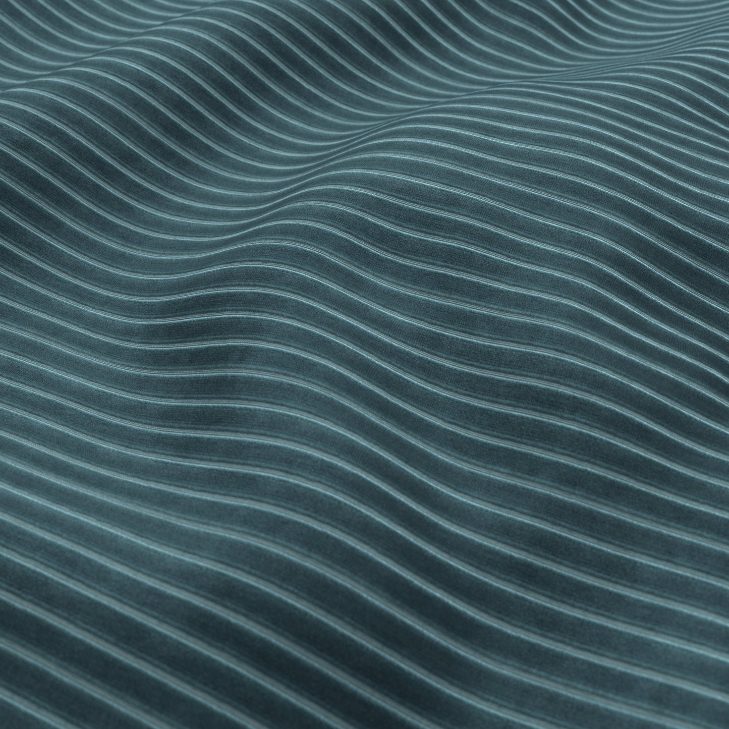Teal fabric texture with flowing curved grooves and ribbed pattern.