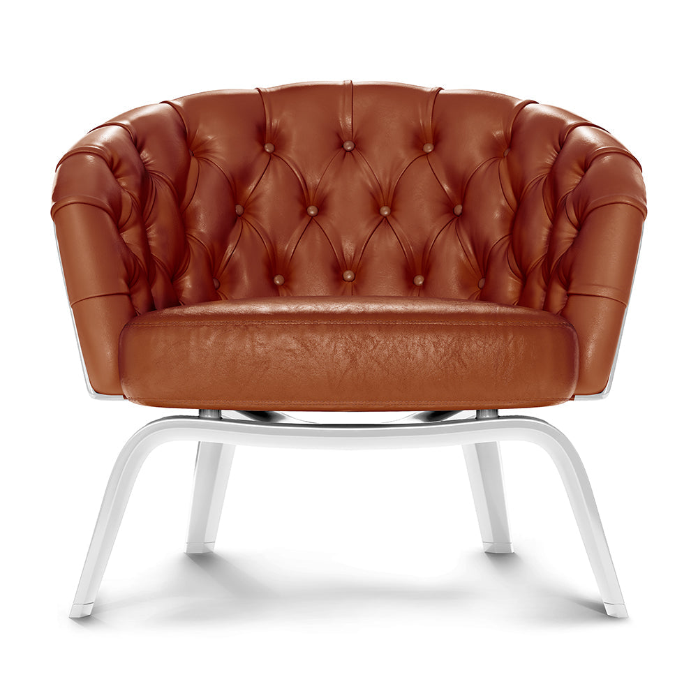 Brown tufted leather lounge chair with rounded back, cushion seat, and white curved-metal legs.
