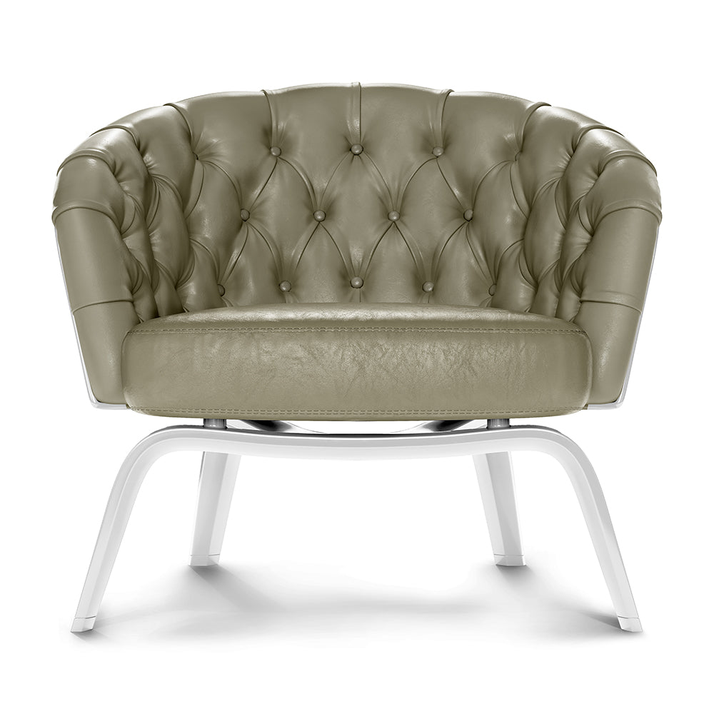 Olive green tufted leather lounge chair with diamond button tufting and white curved metal legs.