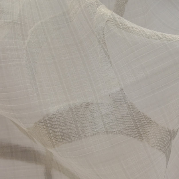 Ivory sheer fabric with a subtle grid weave; lightweight linen-like material with soft drape for curtains or garments.