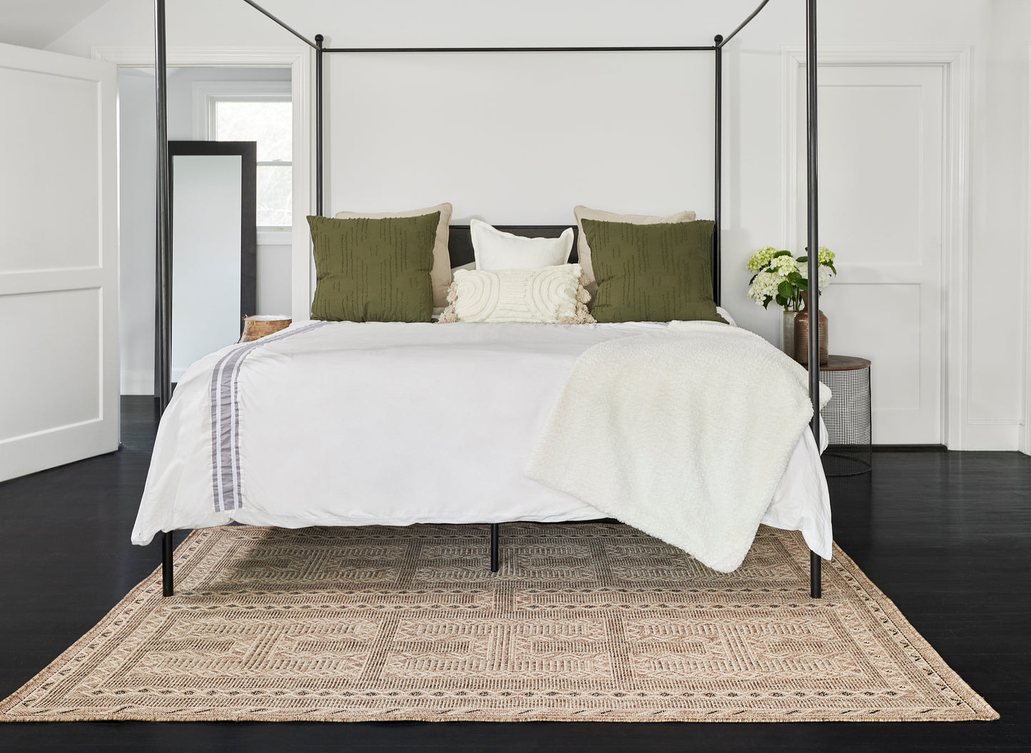 Beige patterned area rug, 7' x 9', with neutral tones.