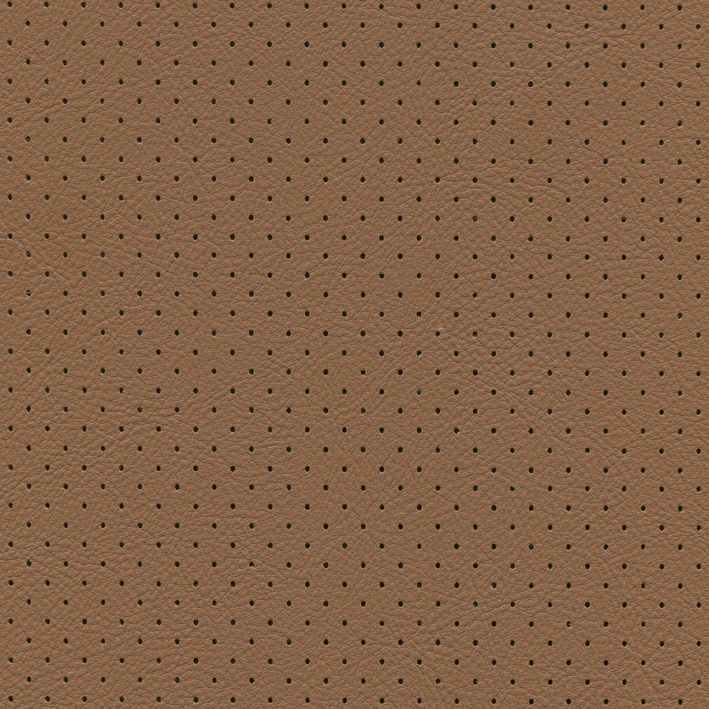 Close-up of brown saddle fabric with evenly spaced tiny perforations.