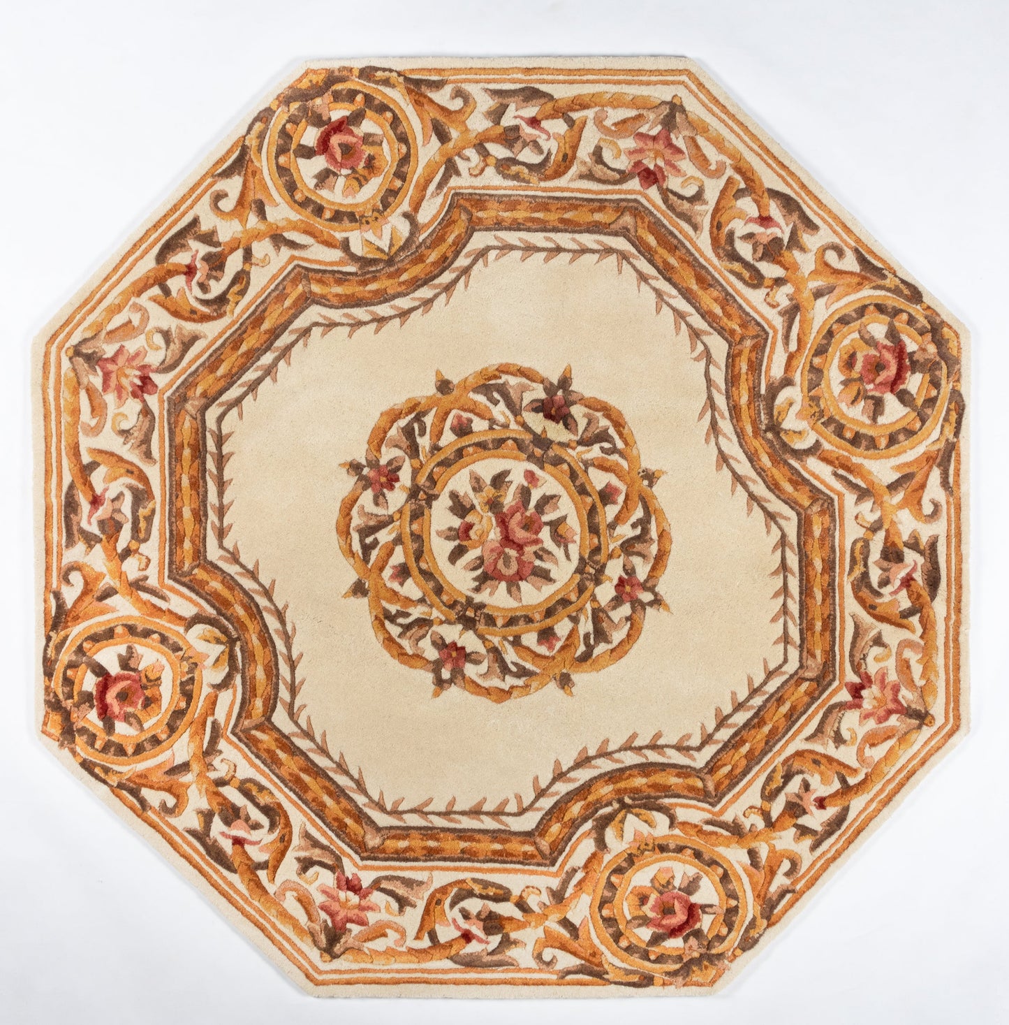 Beige octagonal rug with gold floral border and central medallion; ornate classic design in warm brown, cream and red.