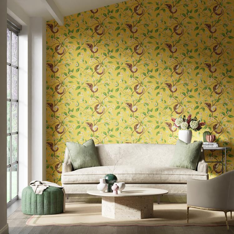 Nellie Wallpaper in Honey and Meadow by Harlequin x Diane Hill featuring golden kadamba flowers, botanical motifs, and a stylized malabar giant squirrel inspired by Indian miniature paintings. Luxury designer wallpaper with warm honey yellow and meadow green tones, ideal for statement walls, maximalist interiors, eclectic décor, living rooms, dining rooms, bedrooms, and artistic home design projects.