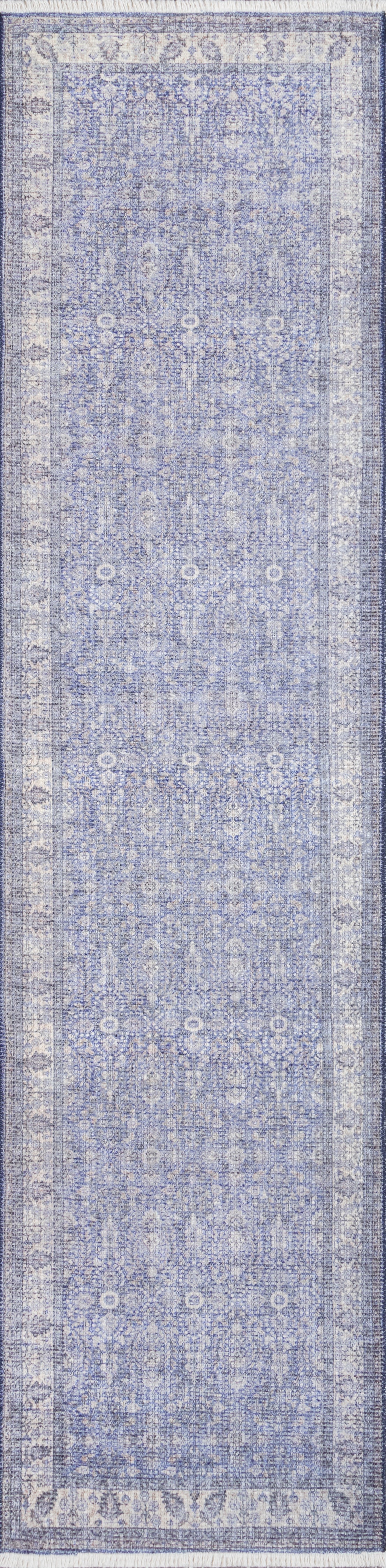 Blue distressed Persian-style runner rug with ivory motifs and ornate border.