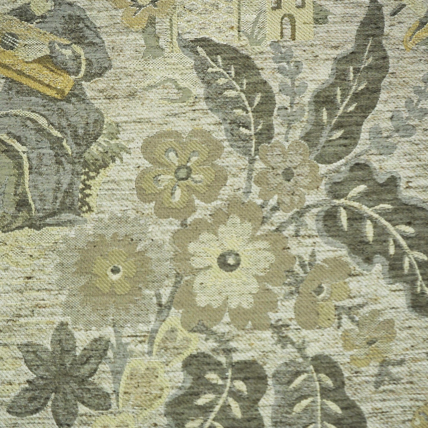 Tapestry-style floral upholstery fabric in muted beige, gray, sage and pale yellow with a textured weave.