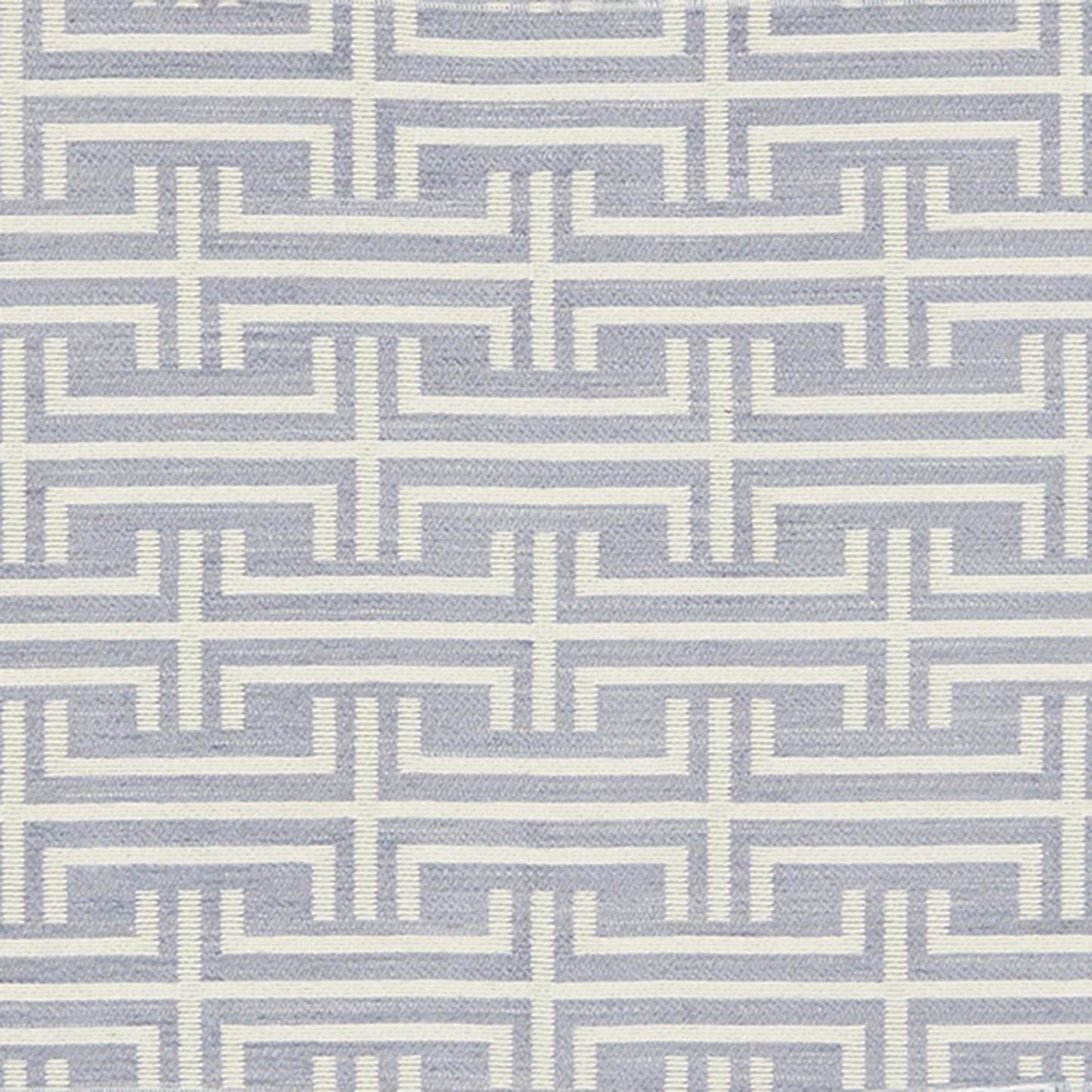 Ivory Greek-key maze pattern on a blue-gray background; repeating geometric border motif suitable for fabric or wallpaper.