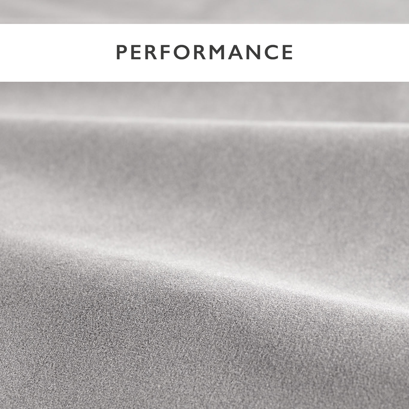 Close-up of dove gray velvet fabric with a smooth nap and subtle sheen.
