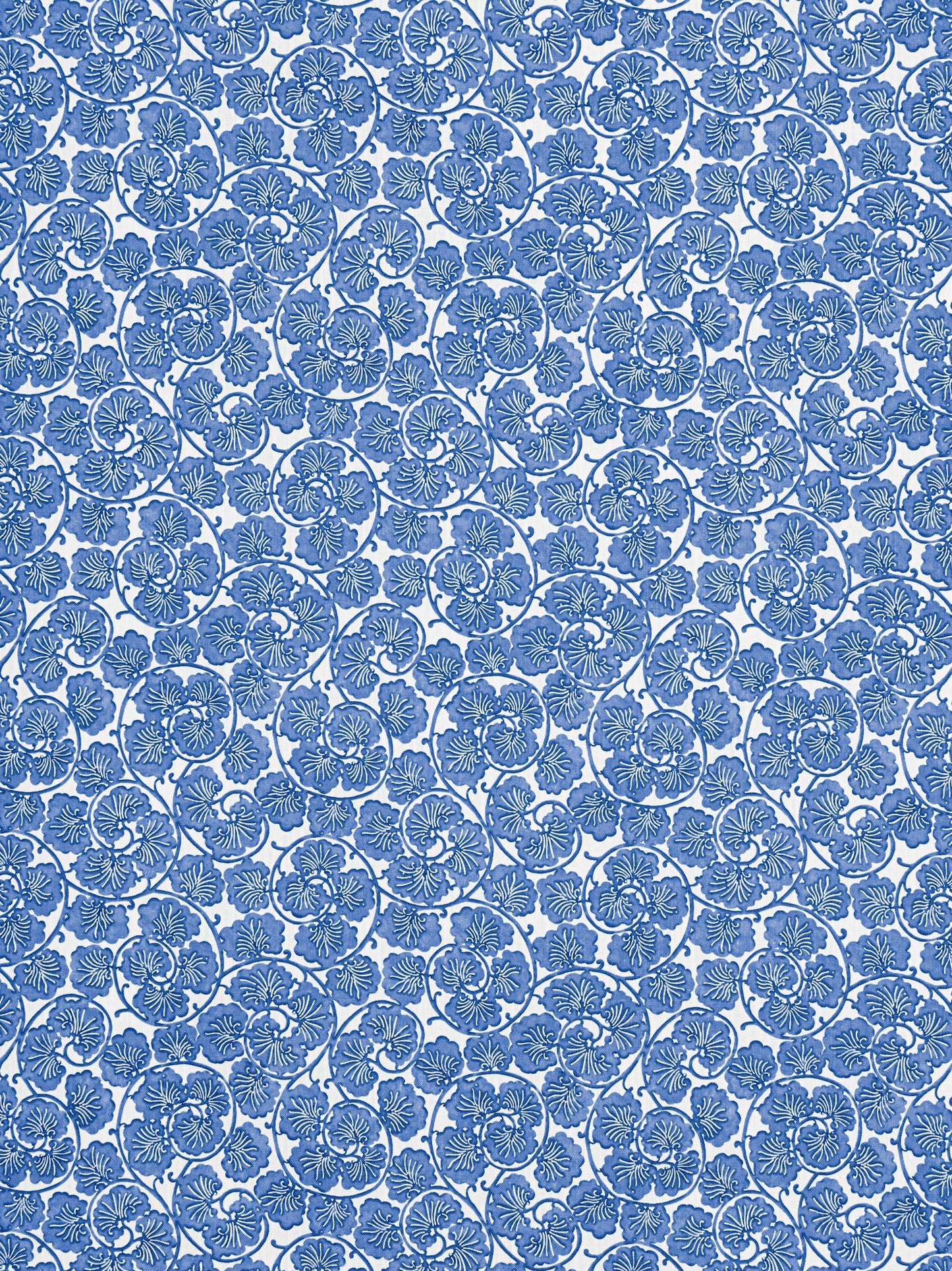 Blue damask floral fabric with repeating rosette motifs; intricate, elegant textile for upholstery or apparel.