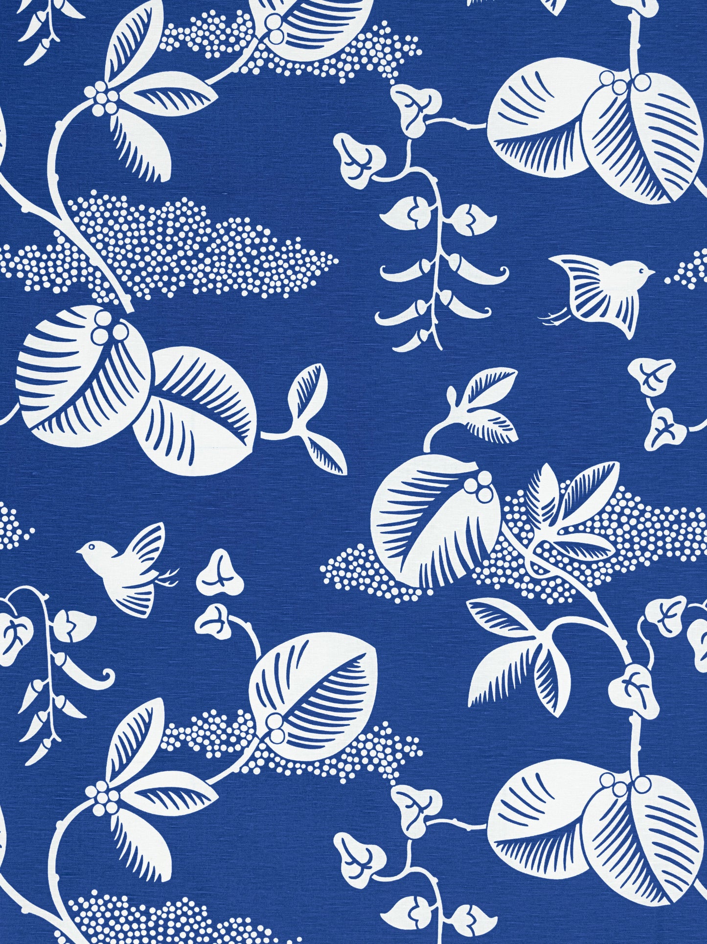 Blue fabric with white botanical pattern featuring leaves, vines, blossoms and small birds.