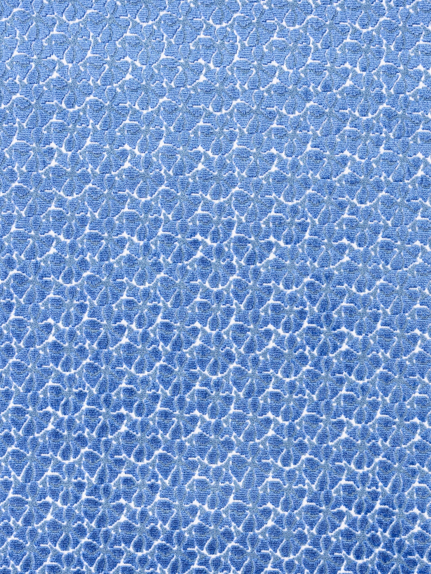 Blue crackle texture with white vein-like lines, fabric or wallpaper pattern.