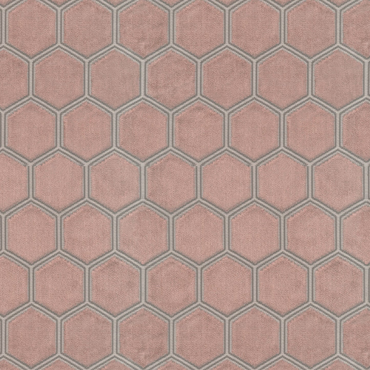Pink velvet fabric with a hexagonal honeycomb geometric pattern.