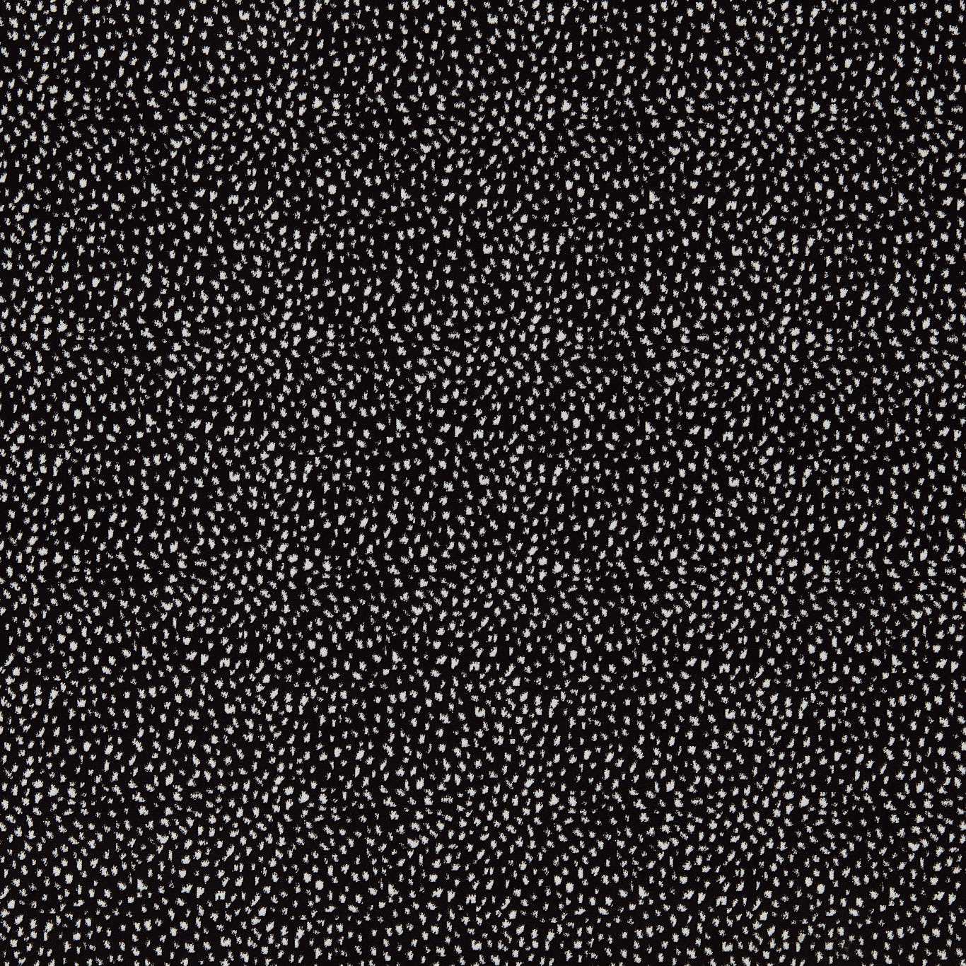 Black fabric with tiny white specks in a micro-dots pattern.