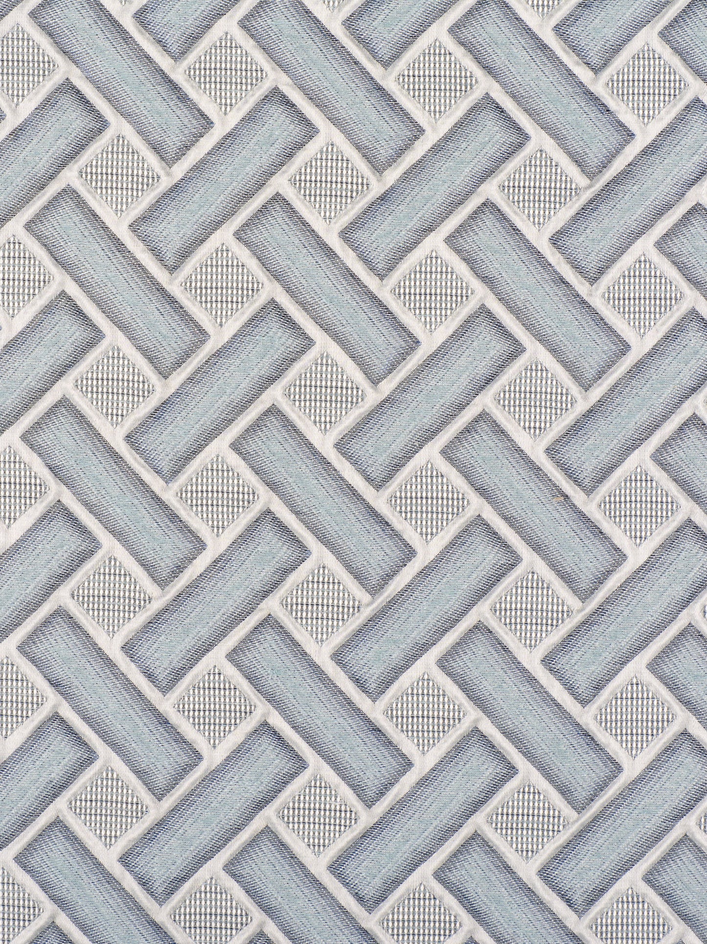 Blue-gray woven basket-weave tile pattern with white grout, wall backsplash style.