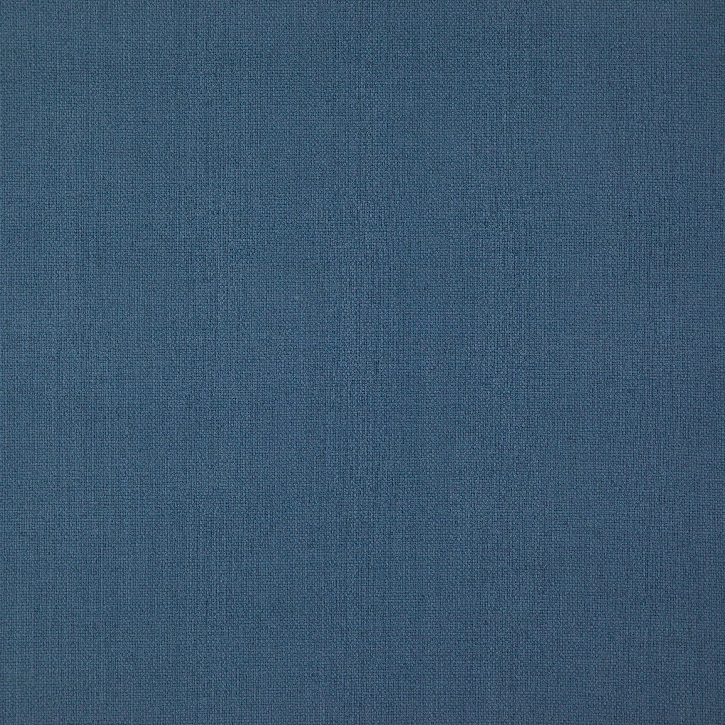 Blue woven fabric texture with tight weave, versatile upholstery or apparel material.