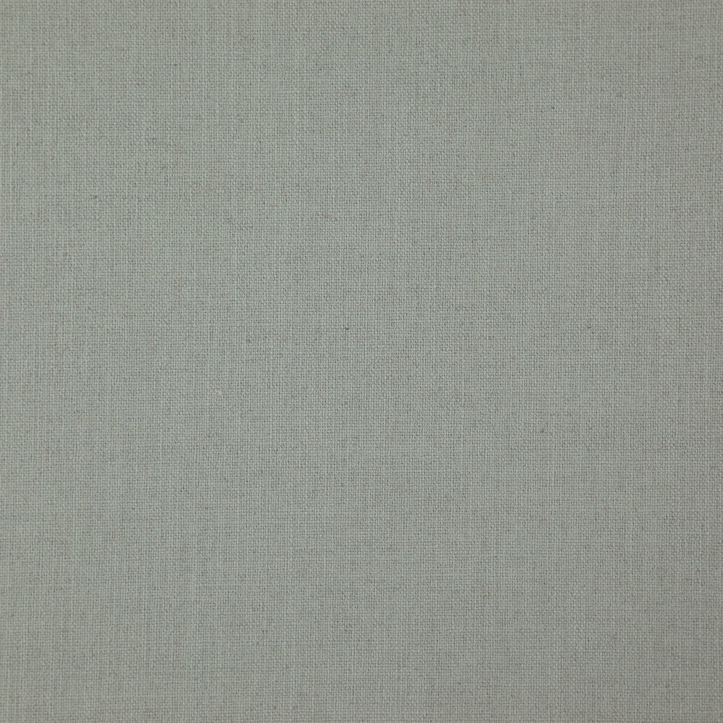 Close-up of light olive-gray linen fabric texture with visible weave.