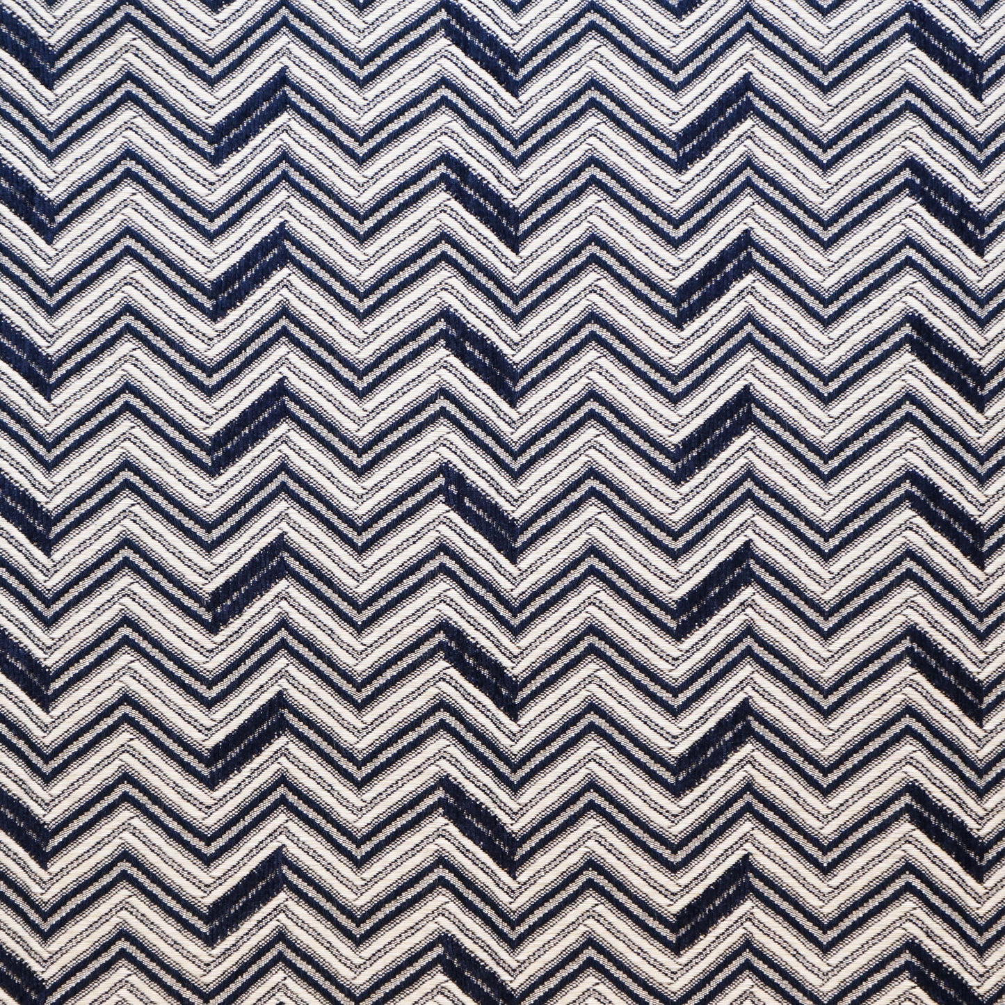 Navy and ivory chevron zigzag jacquard fabric pattern; bold geometric textile.