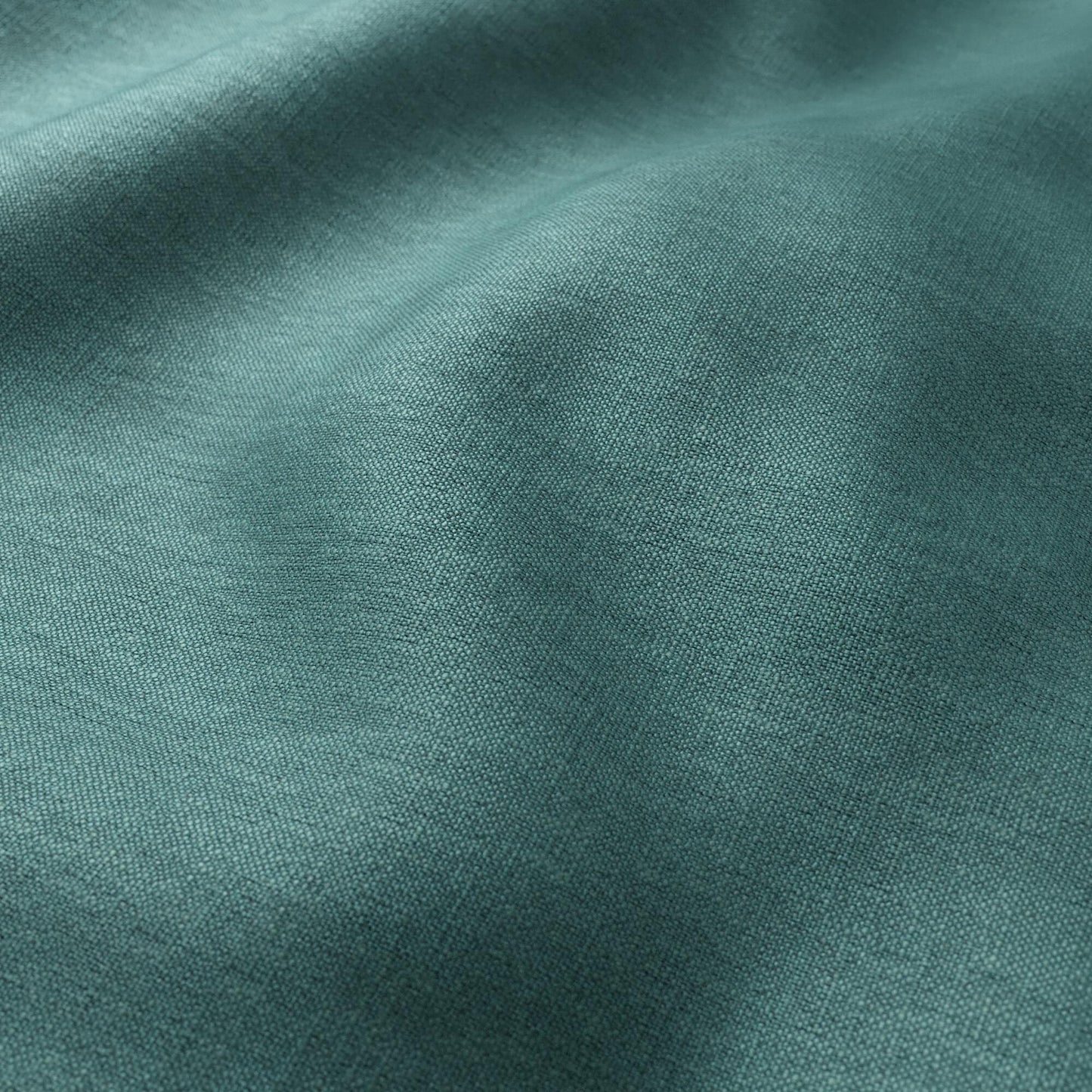 Teal linen blend fabric with soft drape and visible weave texture.