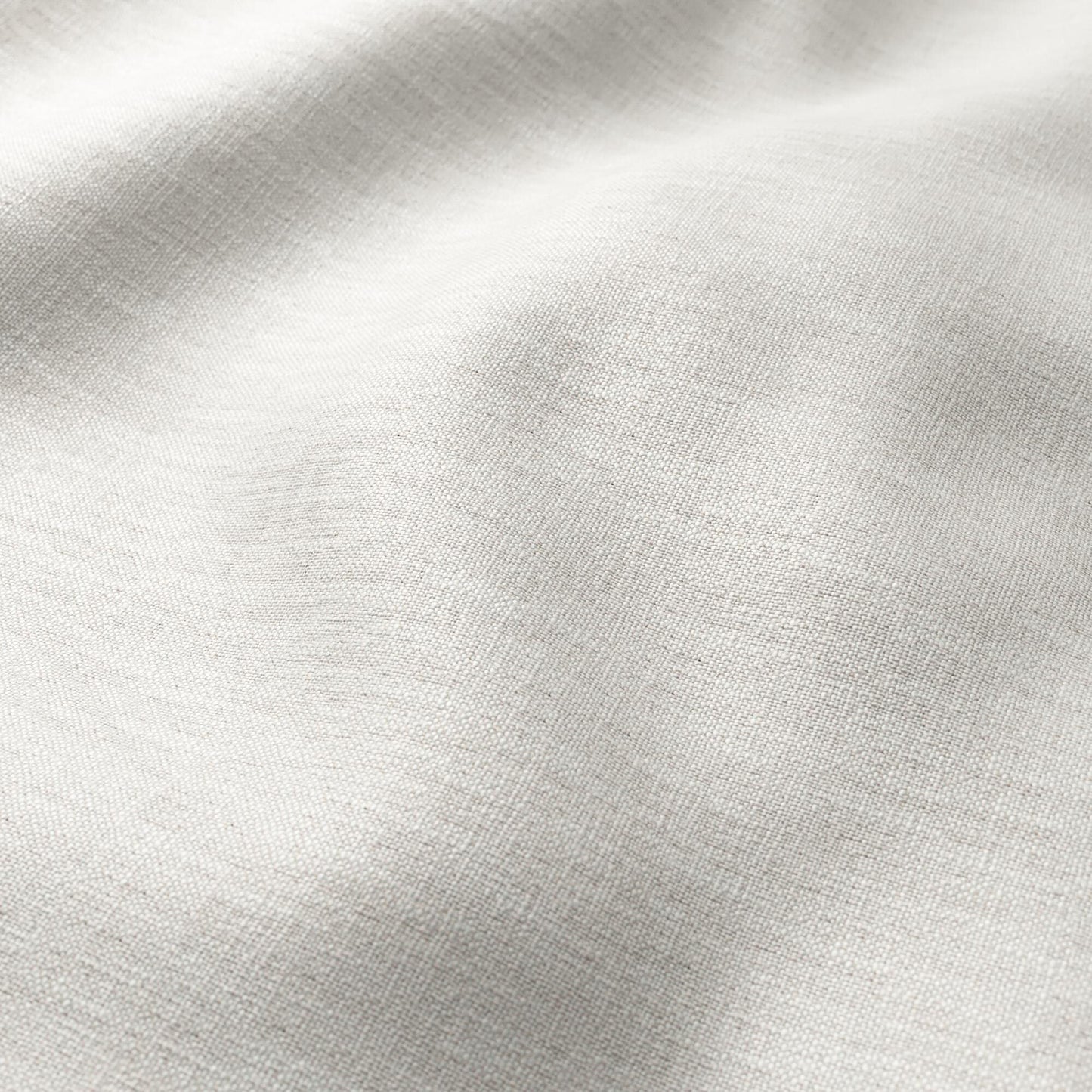 Grey linen texture fabric close-up with soft folds and natural weave; versatile for apparel or home decor.