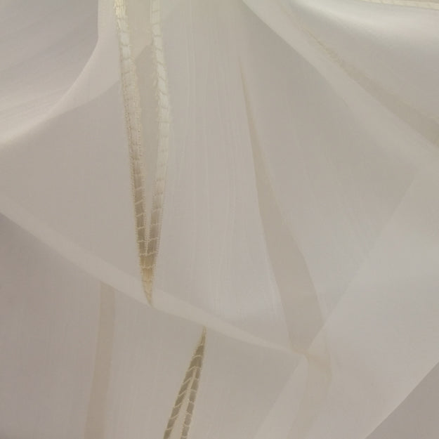 White sheer fabric with layered panels and beige stitched seams; airy dress or veil material