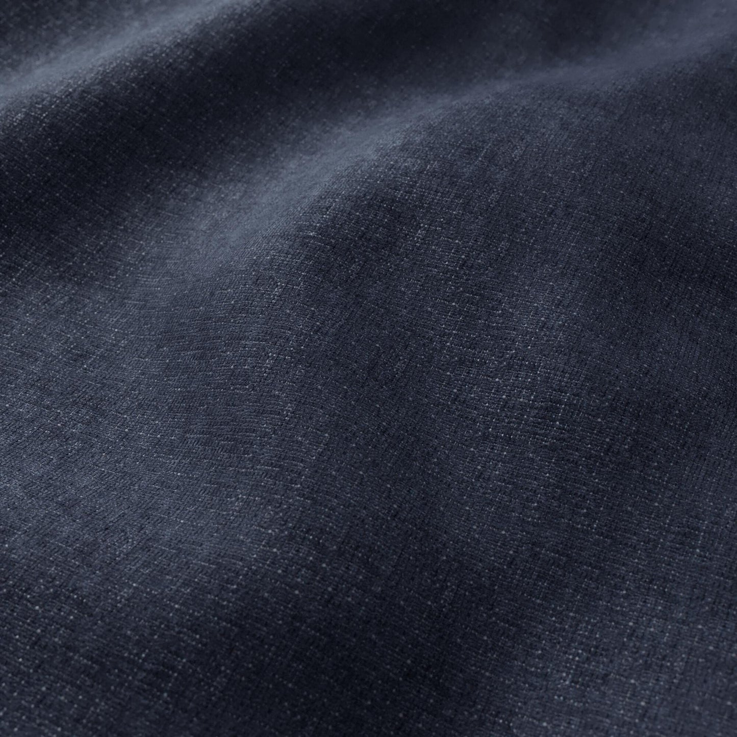 Dark navy chenille fabric close-up showing plush texture and soft folds.