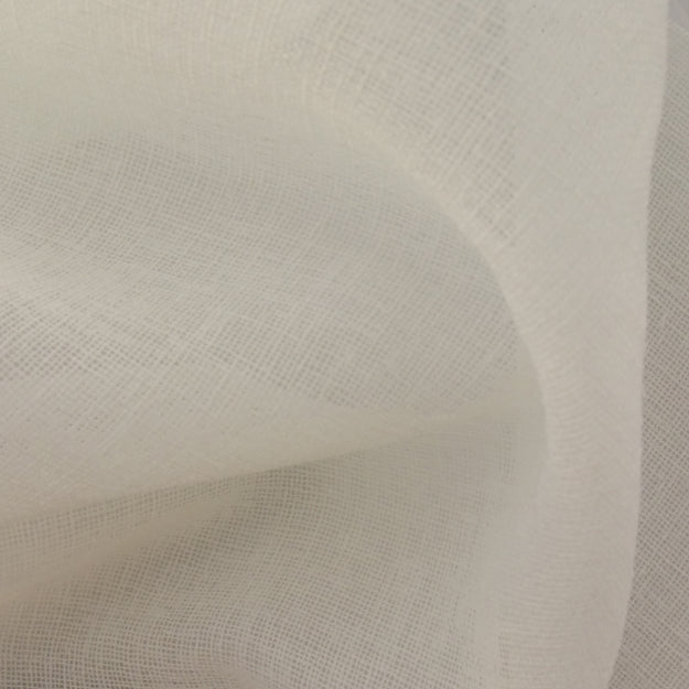 Cream linen-textured fabric with a fine weave and soft draped folds.