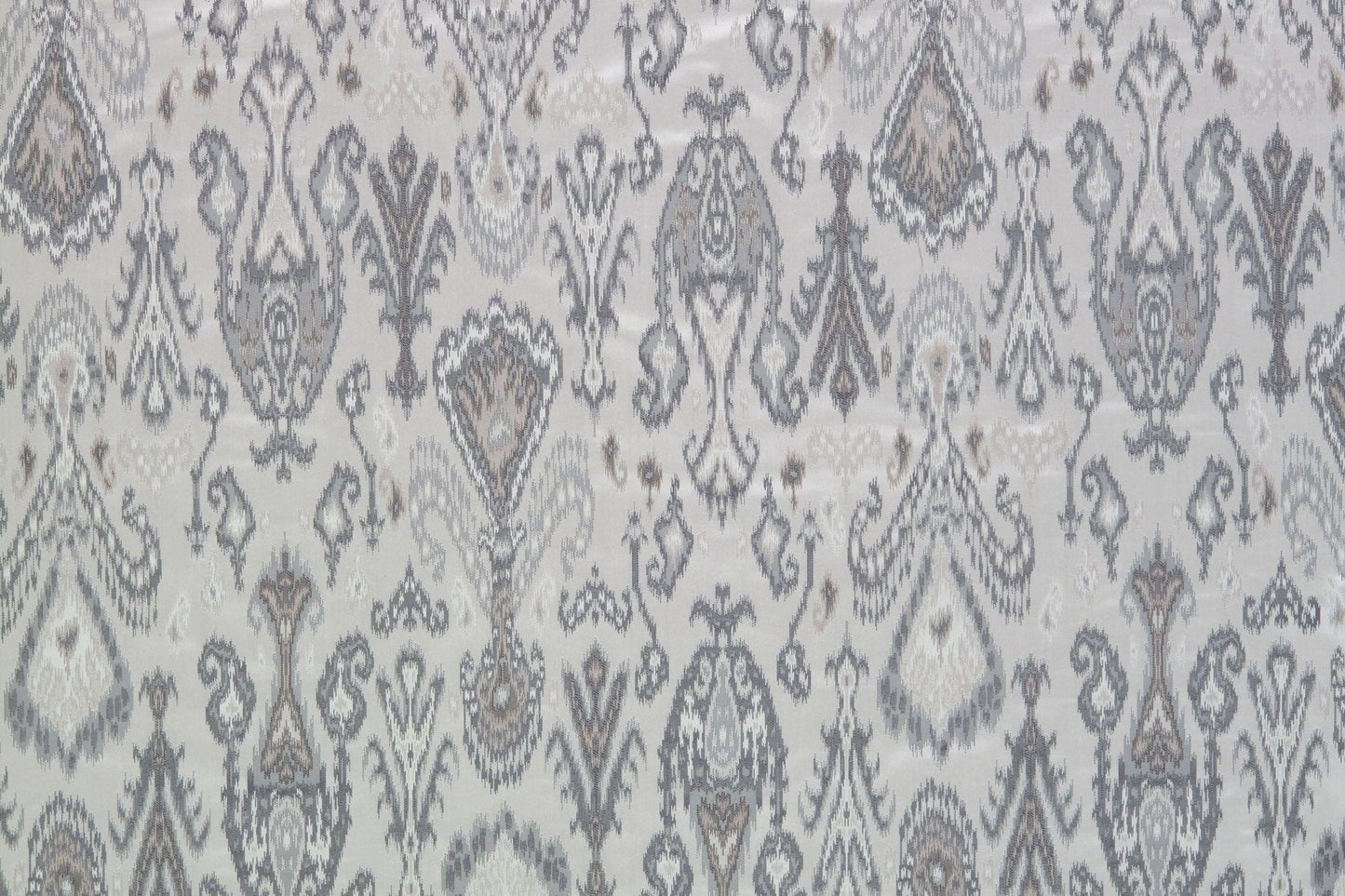 Grey damask patterned fabric with ornate floral motifs, elegant textile for upholstery or curtains.