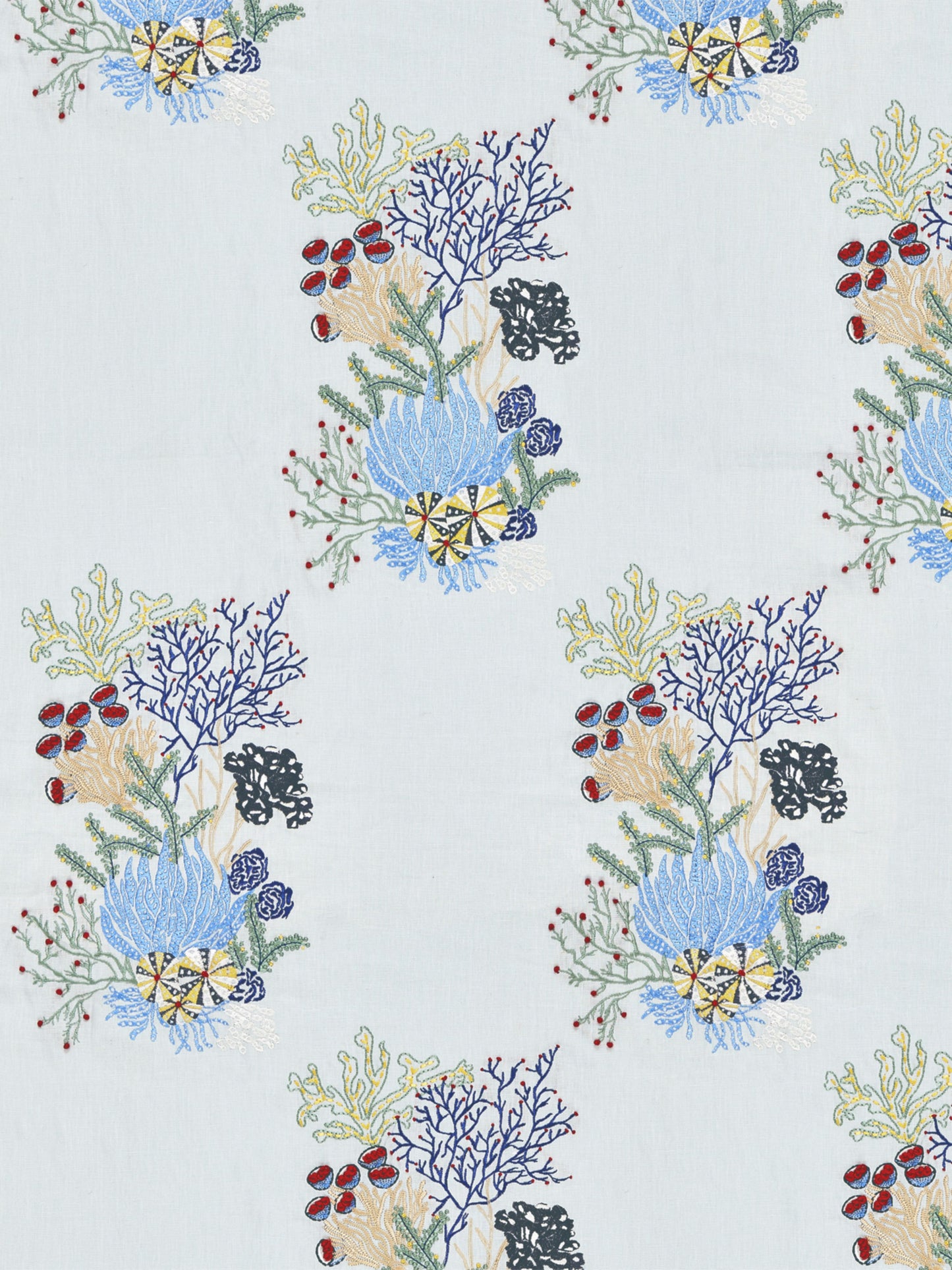 Pale blue fabric with repeating reef-inspired print: blue/purple coral, yellow star shapes, green seaweed, red berries.