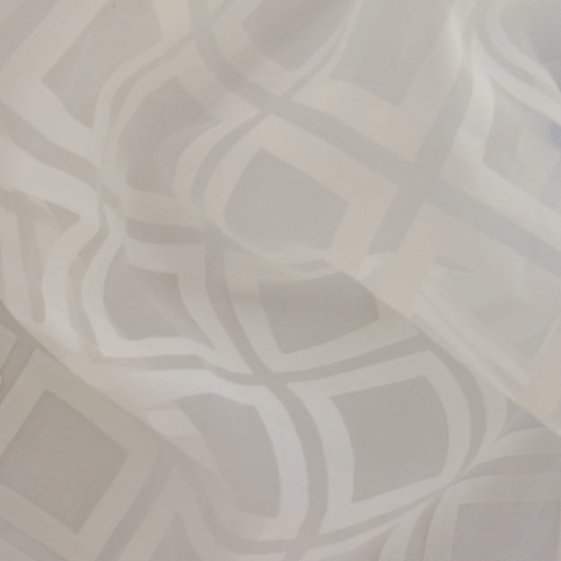 Light gray & white geometric pattern fabric with interlocking square shapes; soft, crumpled textile.