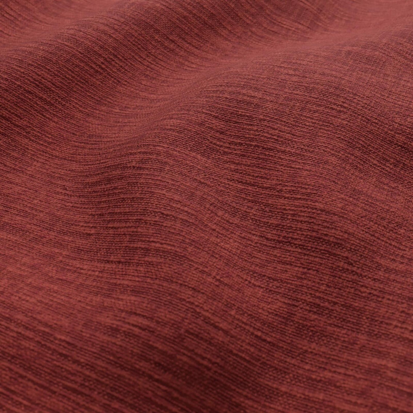 Rust-red woven fabric with a subtle plain weave texture and soft drape.