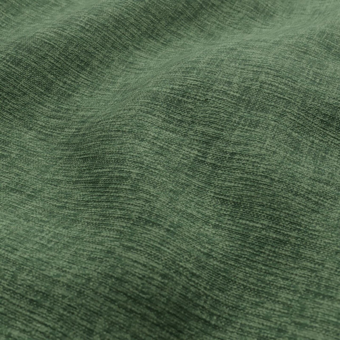 Close-up of emerald green heathered woven fabric with soft folds.