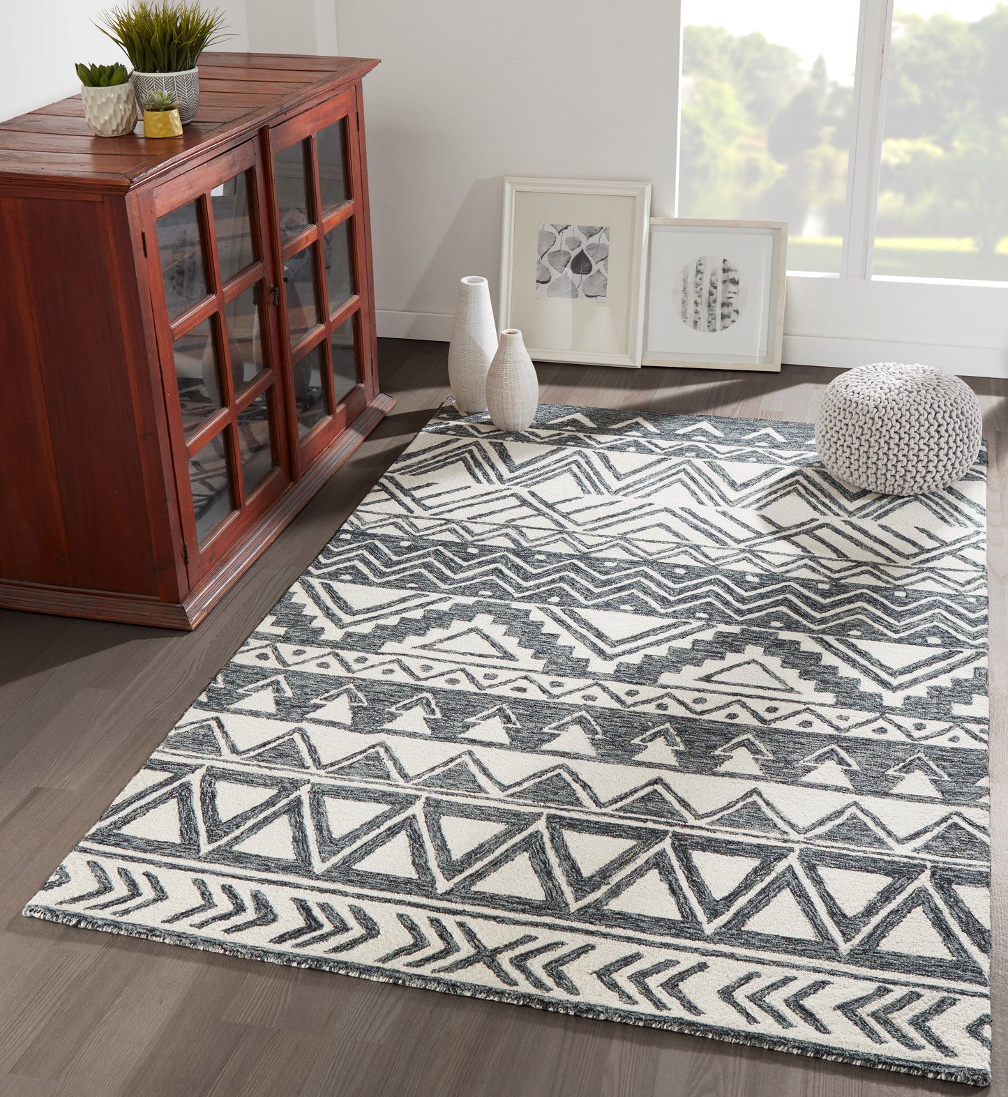 Hand-hooked 8x10 charcoal wool area rug with bold geometric tribal pattern, contemporary home décor accent for living room, bedroom or dining space.