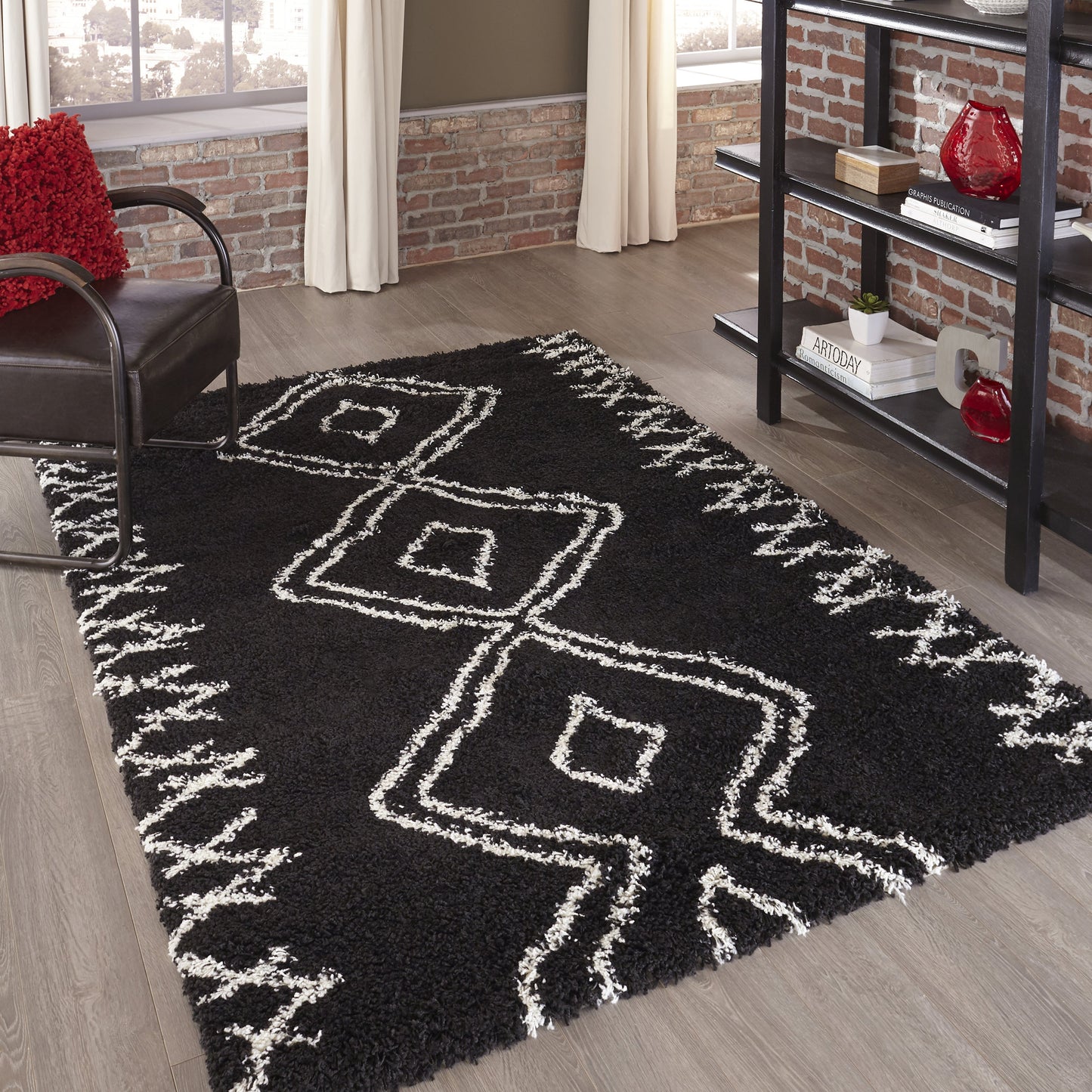 Maya black shag rug with white geometric square pattern in a modern living room.